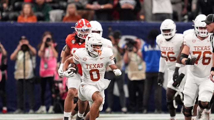 Dec 7, 2024; Atlanta, GA, USA; Texas Longhorns wide receiver DeAndre Moore Jr. (0) makes a catch against the Georgia Bulldogs during the first half in the 2024 SEC Championship game at Mercedes-Benz Stadium. Mandatory Credit: Dale Zanine-Imagn Images