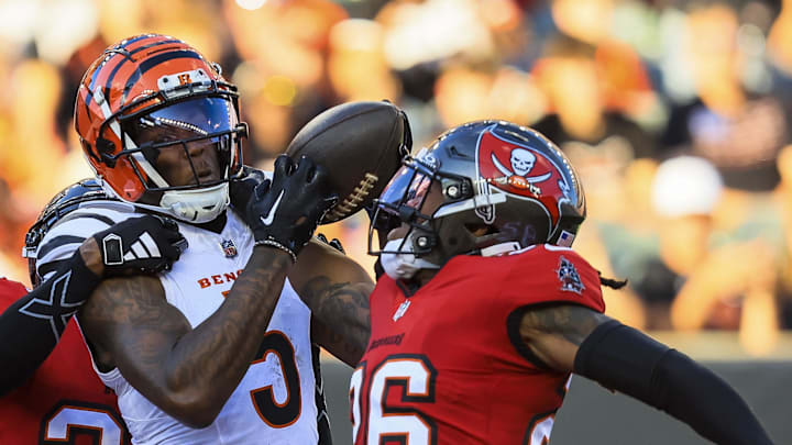 Cincinnati Bengals wide receiver Tee Higgins attempts to catch a pass against Tampa Bay Buccaneers safety Kaevon Merriweather.