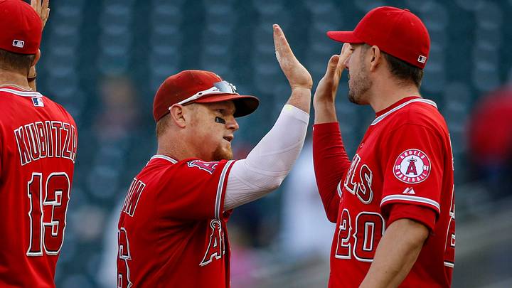 Los Angeles Angels right fielder Kole Calhoun (56) and outfielder Matt Joyce (20) celebrate the 4-3 12 inning win against the Minnesota Twins during game one of a doubleheader at Target Field on Sept. 19, 2015. Los Angeles Angels right fielder Kole Calhoun (56) and outfielder Matt Joyce (20) celebrate the 4-3 12 inning win against the Minnesota Twins during game one of a doubleheader at Target Field on Sept. 19, 2015.