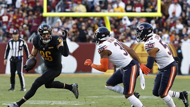 Oct 27, 2024; Landover, Maryland, USA; Washington Commanders tight end Zach Ertz (86) runs with the ball as Chicago Bears safety Kevin Byard III (31) and Bears linebacker T.J. Edwards (53) chase during the second quarter at Northwest Stadium. Mandatory Credit: Geoff Burke-Imagn Images