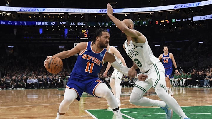 Apr 11, 2024; Boston, Massachusetts, USA;  New York Knicks guard Jalen Brunson (11) controls the ball while Boston Celtics guard Derrick White (9) defends during the first half at TD Garden. Mandatory Credit: Bob DeChiara-USA TODAY Sports