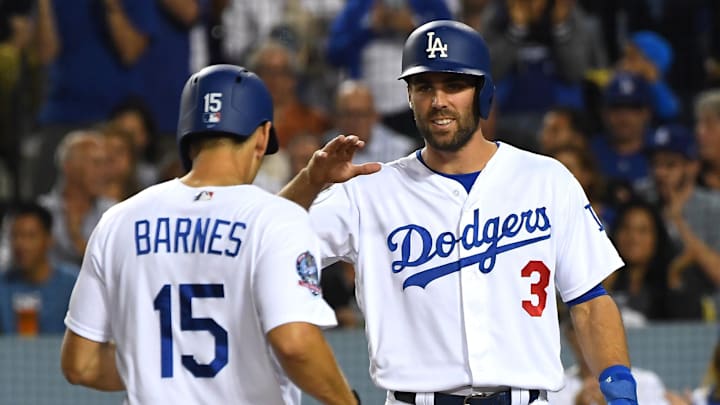Dodgers catcher Austin Barnes (15) is greeted by Los Angeles Dodgers center fielder Chris Taylor (3) after hitting a two run home run in the third inning against the New York Mets at Dodger Stadium.