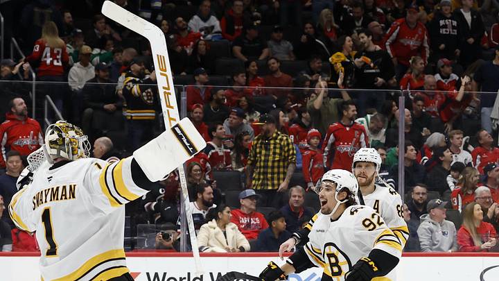 Mar 9, 2026; Washington, District of Columbia, USA; Boston Bruins goaltender Jeremy Swayman (1) celebrates with Bruins center Marat Khusnutdinov (92) and Bruins right wing David Pastrnak (88) after their shootout win against the Washington Capitals at Capital One Arena. Mandatory Credit: Geoff Burke-Imagn Images
