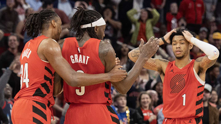 Jan 24, 2024; Houston, Texas, USA; Portland Trail Blazers forward Jabari Walker (34) and guard Anfernee Simons (1) celebrate with forward Jerami Grant (9) after he made a three point basket in the fourth quarter to send the game into overtime against the Houston Rockets at Toyota Center. Mandatory Credit: Thomas Shea-Imagn Images Jan 24, 2024; Houston, Texas, USA; Portland Trail Blazers forward Jabari Walker (34) and guard Anfernee Simons (1) celebrate with forward Jerami Grant (9) after he made a three point basket in the fourth quarter to send the game into overtime against the Houston Rockets at Toyota Center. Mandatory Credit: Thomas Shea-Imagn Images