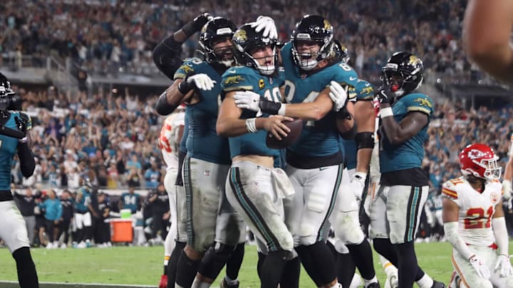 Oct 6, 2025; Jacksonville, Florida, USA; Jacksonville Jaguars quarterback Trevor Lawrence (16) celebrates with teammates after scoring a touchdown during the second half against the Kansas City Chiefs at EverBank Stadium. Mandatory Credit: Morgan Tencza-Imagn Images