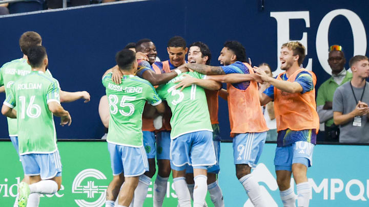 Aug 24, 2025; Seattle, Washington, USA; Seattle Sounders FC midfielder Snyder Brunell (37) celebrates with teammates after scoring a goal against the Sporting Kansas City during the second half at Lumen Field. Mandatory Credit: Joe Nicholson-Imagn Images