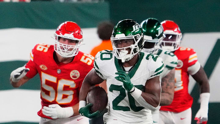 Oct 1, 2023; East Rutherford, New Jersey, USA; New York Jets running back Breece Hall (20) runs past the Chiefs defense for a 2nd half 1st down at MetLife Stadium. Mandatory Credit: Robert Deutsch-Imagn Images