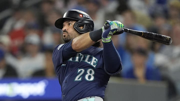 Oct 20, 2025; Toronto, Ontario, CAN; Seattle Mariners third baseman Eugenio Suarez (28) hits a single against the Toronto Blue Jays in the second inning during game seven of the ALCS round for the 2025 MLB playoffs at Rogers Centre.  