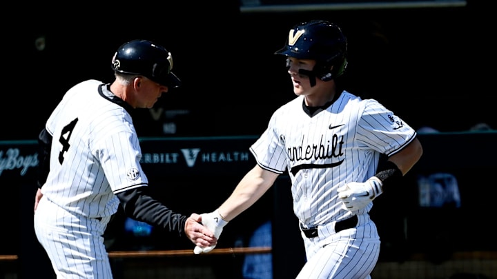 Vanderbilt's Ryker Waite (51) is congratulated by coach Tim Corbin after hitting two-run home run during the fourth inning of a NCAA baseball game at Hawkins Field on Saturday, March 28, 2026, in Nashville, Tenn. Vanderbilt's Ryker Waite (51) is congratulated by coach Tim Corbin after hitting two-run home run during the fourth inning of a NCAA baseball game at Hawkins Field on Saturday, March 28, 2026, in Nashville, Tenn.