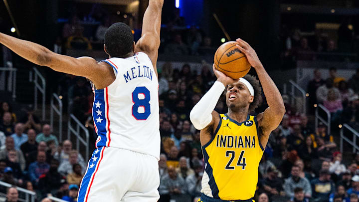Mar 18, 2023; Indianapolis, Indiana, USA; Indiana Pacers guard Buddy Hield (24) shoots the ball while Philadelphia 76ers guard De'Anthony Melton (8) defends in the second quarter at Gainbridge Fieldhouse. Mandatory Credit: Trevor Ruszkowski-Imagn Images