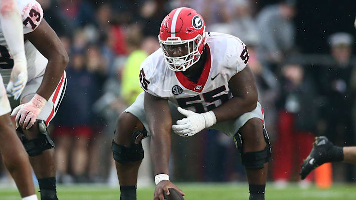 Nov 9, 2024; Oxford, Mississippi, USA; Georgia Bulldogs offensive lineman Jared Wilson (55) prepares to snap the ball during the first half against the Mississippi Rebels at Vaught-Hemingway Stadium. Mandatory Credit: Petre Thomas-Imagn Images