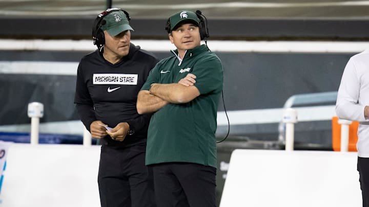 Michigan State Spartans head coach Jonathan Smith looks toward the scoreboard during a timeout as the Ducks host the Spartans Friday, Oct. 4, 2024 at Autzen Stadium in Eugene, Ore. Michigan State Spartans head coach Jonathan Smith looks toward the scoreboard during a timeout as the Ducks host the Spartans Friday, Oct. 4, 2024 at Autzen Stadium in Eugene, Ore.