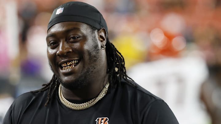 Cincinnati Bengals defensive tackle T.J. Slaton Jr. smiles on the bench