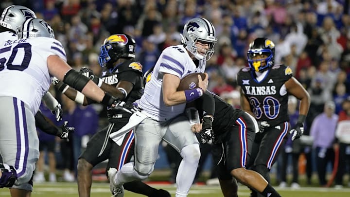 Nov 18, 2023; Lawrence, Kansas, USA; Kansas State Wildcats quarterback Will Howard (18) runs the