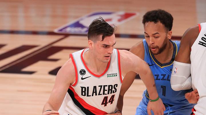July 31, 2020; Lake Buena Vista, USA; Mario Hezonja #44 of the Portland Trail Blazers dribbles against Kyle Anderson #1 of the Memphis Grizzlies during the first half at The Arena at ESPN Wide World Of Sports Complex on July 31, 2020 in Lake Buena Vista, Florida. Mandatory Credit: Mike Ehrmann/Pool Photo via USA TODAY Sports July 31, 2020; Lake Buena Vista, USA; Mario Hezonja #44 of the Portland Trail Blazers dribbles against Kyle Anderson #1 of the Memphis Grizzlies during the first half at The Arena at ESPN Wide World Of Sports Complex on July 31, 2020 in Lake Buena Vista, Florida. Mandatory Credit: Mike Ehrmann/Pool Photo via USA TODAY Sports