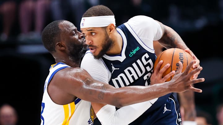 Apr 5, 2024; Dallas, Texas, USA;  Golden State Warriors forward Draymond Green (23) defends Dallas Mavericks center Daniel Gafford (21) during the second half at American Airlines Center. Mandatory Credit: Kevin Jairaj-Imagn Images