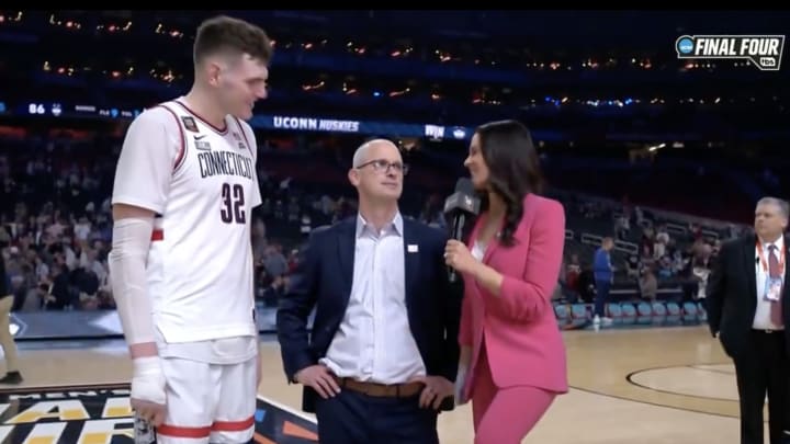Connecticut center Donovan Clingan, coach Dan Hurley and CBS's Tracy Wolfson.