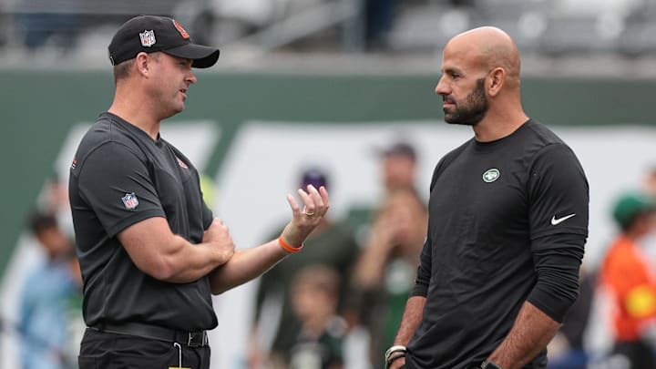 Sep 25, 2022; East Rutherford, New Jersey, USA; Cincinnati Bengals head coach Zac Taylor (left) talks with New York Jets head coach Robert Saleh (right) before the game at MetLife Stadium. Mandatory Credit: Vincent Carchietta-Imagn Images