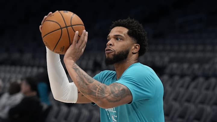 Feb 3, 2025; Charlotte, North Carolina, USA;  Charlotte Hornets forward Miles Bridges (0) shoots during pregame warm ups against the Washington Wizards at Spectrum Center. Mandatory Credit: Jim Dedmon-Imagn Images