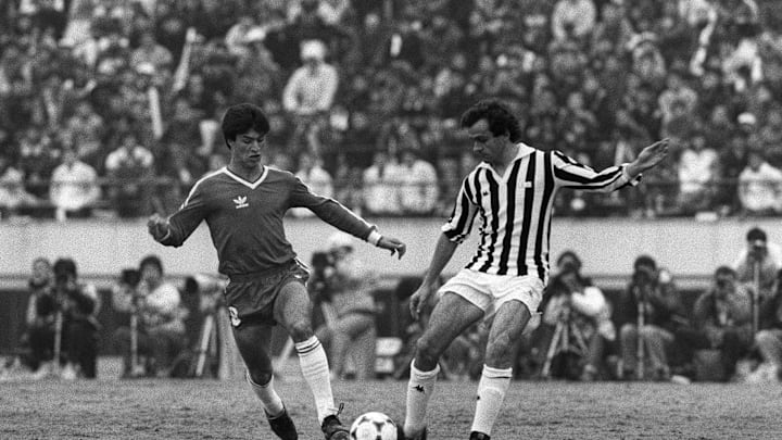 Michel Platini (R) of Juventus is fighti