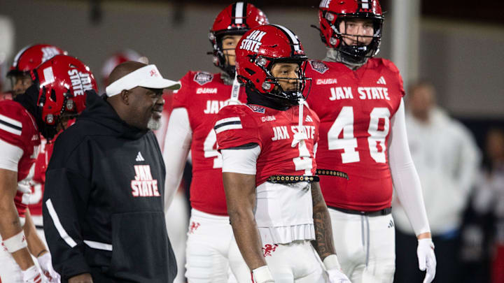 Jacksonville State Gamecocks running back Cam Cook (4) warms up as Troy Trojans take on Jacksonville State Gamecocks during the IS4S Salute to Veterans Bowl at Cramton Bowl in Montgomery, Ala. on Tuesday, Dec. 16, 2025.