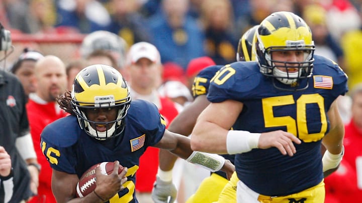 Ohio State Buckeyes linebacker Tyler Moeller (26) tries to tackle Michigan Wolverines quarterback
