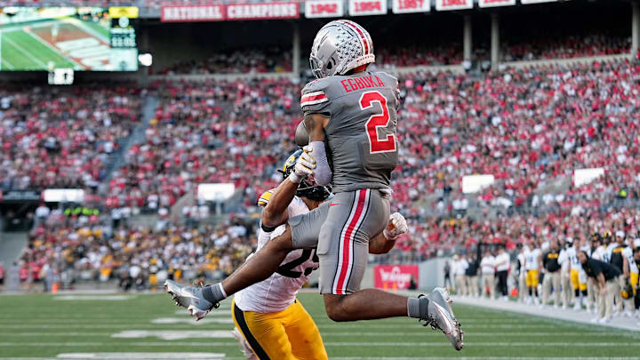 Oct 5, 2024; Columbus, OH, USA; Ohio State Buckeyes wide receiver Emeka Egbuka (2) makes a touchdown catch against Iowa Hawkeyes defensive back Sebastian Castro (29) in the fourth quarter during the NCAA football game at Ohio Stadium.