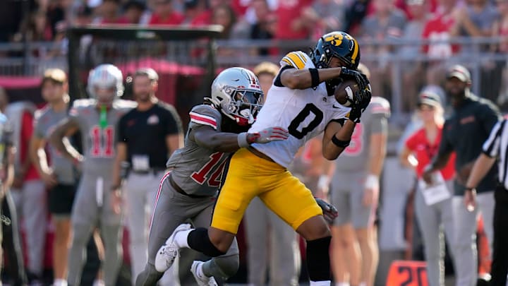 Oct 5, 2024; Columbus, OH, USA; Iowa Hawkeyes wide receiver Jarriett Buie (0) makes a catch against Ohio State Buckeyes cornerback Denzel Burke (10) in the second quarter during the NCAA football game at Ohio Stadium.