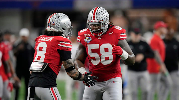 Ohio State Buckeyes safety Lathan Ransom (8) and Ohio State Buckeyes defensive tackle Ty Hamilton (58) do a hand shake during final warm ups at the Cotton Bowl Classic before their game against Texas Longhorns in the College Football Playoff semifinal game at AT&T Stadium in Arlington, Texas on January, 10, 2025.