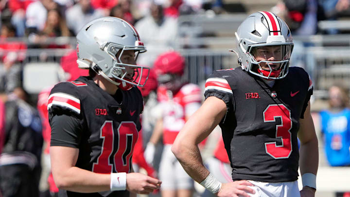 Ohio State Buckeye quarterbacks Julian Sayin (10) and Lincoln Kienholz (3) warm up before the start of the spring game at Ohio Stadium on April 12, 2025.