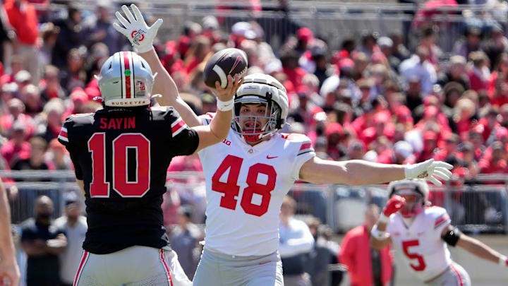Ohio State Buckeye Scarlet Julian Sayin (10) throws a pass against Gary Logan George (48) in the 1st half during the spring game at Ohio Stadium on April 12, 2025.