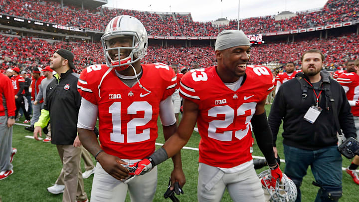 Ohio State Buckeyes safety Tyvis Powell (23) and Ohio State Buckeyes quarterback Cardale Jones (12) celebrate their win over Michigan Wolverines at Ohio Stadium in Columbus, Ohio on November 29, 2014.  (Dispatch photo by Kyle Robertson)

Osu14um Kr 39
