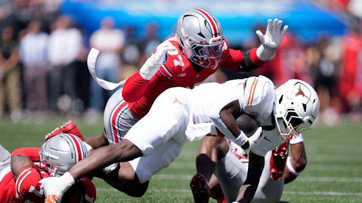 Ohio State Buckeyes defensive end Kenyatta Jackson Jr. (97) tackles Texas Longhorns running back Quintrevion Wisner (5) on a run in the third quarter of their game at Ohio Stadium in Columbus, Ohio on Aug 30, 2025.