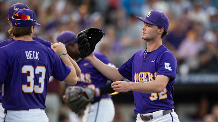 LSU Tigers' Kade Anderson (32) celebrates the end of an inning as LSU Tigers take on Texas A&M Aggies during the SEC baseball tournament at Hoover Met in Birmingham, Ala., on Friday, May 23, 2025. LSU Tigers' Kade Anderson (32) celebrates the end of an inning as LSU Tigers take on Texas A&M Aggies during the SEC baseball tournament at Hoover Met in Birmingham, Ala., on Friday, May 23, 2025.