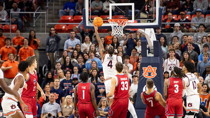 Auburn Tigers forward Johni Broome (4) goes up for a layup as Auburn Tigers take on Richmond Spiders at Neville Arena in Auburn, Ala., on Saturday, Dec. 8, 2024.