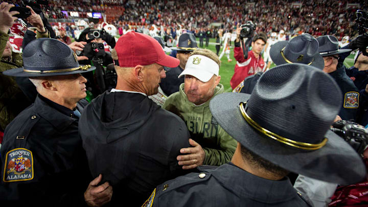 Alabama Crimson Tide head coach Kalen DeBoer and Auburn Tigers head coach Hugh Freeze shake hands after the game as Auburn Tigers take on Alabama Crimson Tide at Bryant-Denny Stadium in Tuscaloosa, Ala., on Saturday, Nov. 30, 2024. Alabama Crimson Tide defeated Auburn Tigers 28-14.