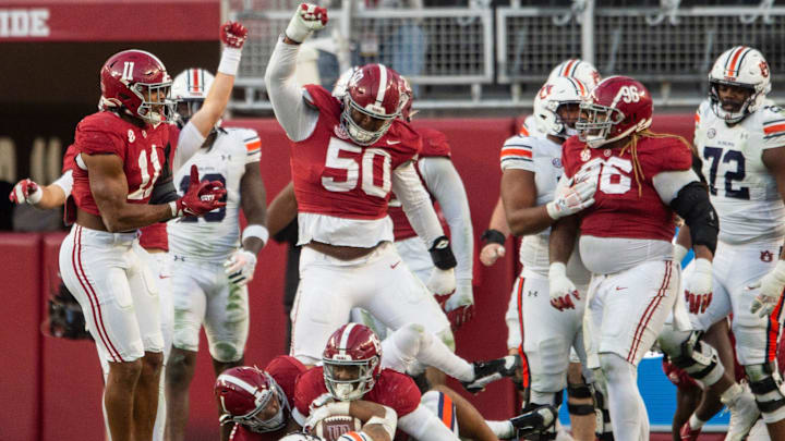 Auburn Tigers running back Jarquez Hunter (27) is stopped during an Alabama Crimson Tide goal line stand at the end of the first half as Auburn Tigers take on Alabama Crimson Tide at Bryant-Denny Stadium in Tuscaloosa, Ala., on Saturday, Nov. 30, 2024. Alabama Crimson Tide leads Auburn Tigers 14-6 at halftime.