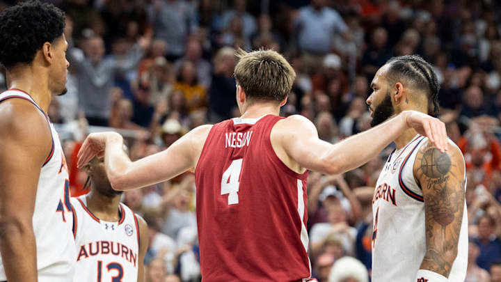Alabama Crimson Tide forward Grant Nelson (4) celebrates his dunk as Auburn Tigers take on Alabama Crimson Tide at Neville Arena in Auburn, Ala., on Saturday, March 8, 2025. Alabama Crimson Tide lead Auburn Tigers 45-42 at halftime.