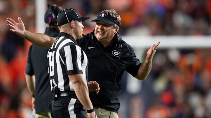 Georgia Bulldogs head coach Kirby Smart talks with an official as Auburn Tigers take on Georgia Bulldogs at Jordan-Hare Stadium in Auburn, Ala. on Saturday, Oct. 11, 2025. Georgia Bulldogs defeated Auburn Tigers 20-10.