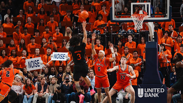 Feb 21, 2026; Charlottesville, Virginia, USA; Miami (FL) Hurricanes guard Tre Donaldson (3) shoots the ball while Virginia Cavaliers guard Jacari White (6) defends during the second half at John Paul Jones Arena. Mandatory Credit: Emily Faith Morgan-Imagn Images