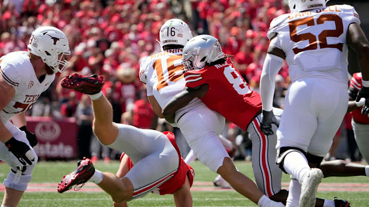 Aug 30, 2025; Columbus, Ohio, USA; Ohio State Buckeyes linebacker Arvell Reese (8) tackles Texas Longhorns quarterback Arch Manning (16) on a run during the first quarter at Ohio Stadium. Mandatory Credit: Kyle Robertson - Imagn Images