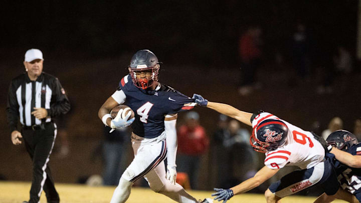 Lee-Scott's Griffin Gaston (9) pulls down Montgomery Academy's Braden Gordon (4) at Montgomery Academy in Montgomery, Ala. on Friday, Nov. 14, 2025. Montgomery Academy leads Lee-Scott 28-0 at halftime.