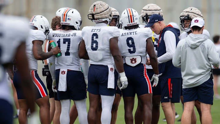 Auburn Tigers defensive coordinator DJ Durkin huddles with players during practice at Woltosz Football Performance Center in Auburn, Ala., on Tuesday, April 2, 2024.