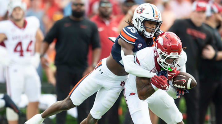Auburn Tigers defensive back Champ Anthony (25) breaks up a pass intended for Arkansas Razorbacks wide receiver Tyrone Broden (5) as Auburn Tigers take on Arkansas Razorbacks at Jordan-Hare Stadium in Auburn, Ala., on Saturday, Sept. 21, 2024. Arkansas Razorbacks lead Auburn Tigers 7-0 at halftime.
