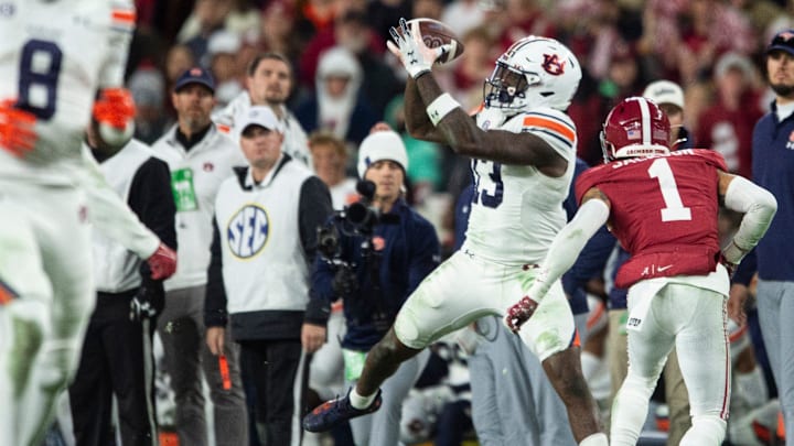 Auburn Tigers tight end Rivaldo Fairweather (13) catches a pass as Auburn Tigers take on Alabama Crimson Tide at Bryant-Denny Stadium in Tuscaloosa, Ala., on Saturday, Nov. 30, 2024. Alabama Crimson Tide defeated Auburn Tigers 28-14.