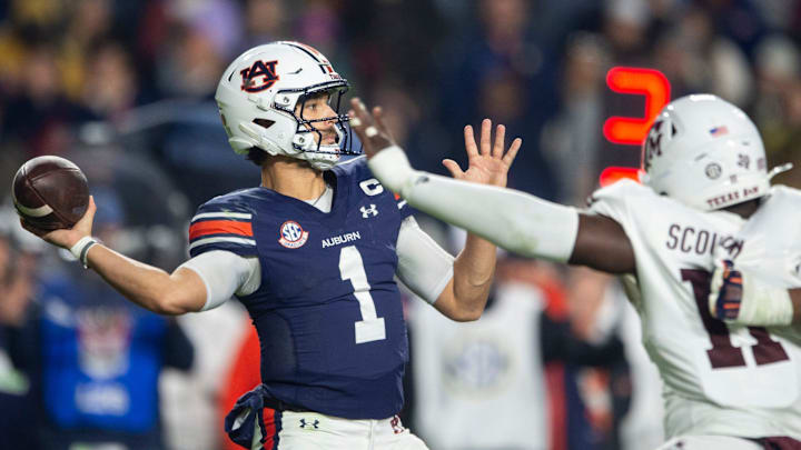 Auburn Tigers quarterback Payton Thorne (1) throws the ball as Auburn Tigers take on Texas A&M Aggies at Jordan-Hare Stadium in Auburn, Ala., on Saturday, Nov. 23, 2024. Auburn Tigers defeated Texas A&M Aggies 43-41 in fourth overtime.