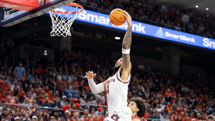 Auburn Tigers forward Johni Broome (4) dunks the ball as Auburn Tigers take on Georgia Bulldogs at Neville Arena in Auburn, Ala., on Saturday, Feb. 22, 2025. Auburn Tigers defeated Georgia Bulldogs 82-70.
