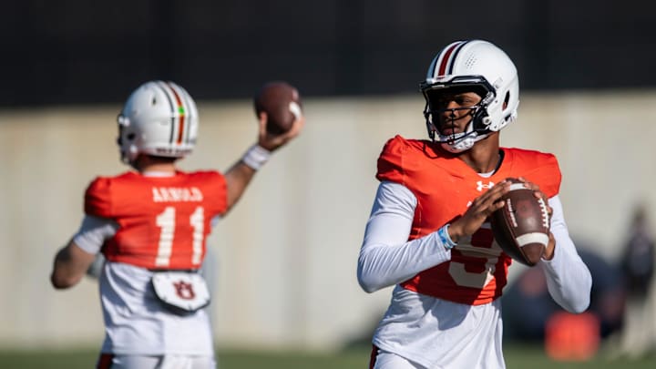 Auburn Tigers quarterback Jackson Arnold (11) and Deuce Knight (9) throw the ball during football practice at Woltosz Football Performance Center in Auburn, Ala., on Thursday, April 10, 2025.