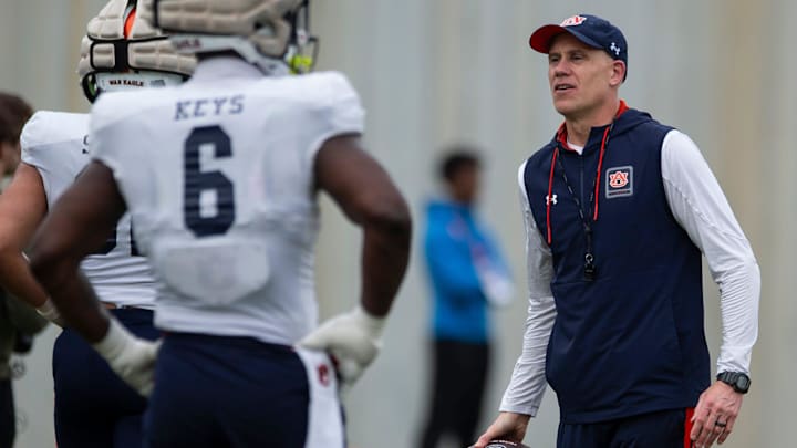 Auburn Tigers defensive coordinator DJ Durkin talks with players during practice at Woltosz Football Performance Center in Auburn, Ala., on Tuesday, April 2, 2024.