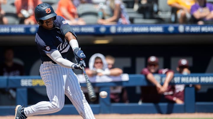 Auburn Tigers' Eric Guevara (8) swings at the ball as Auburn Tigers take on Texas A&M Aggies during the SEC baseball tournament at Hoover Met in Birmingham, Ala., on Thursday, May 22, 2025. Texas A&M Aggies defeated Auburn Tigers 3-2.